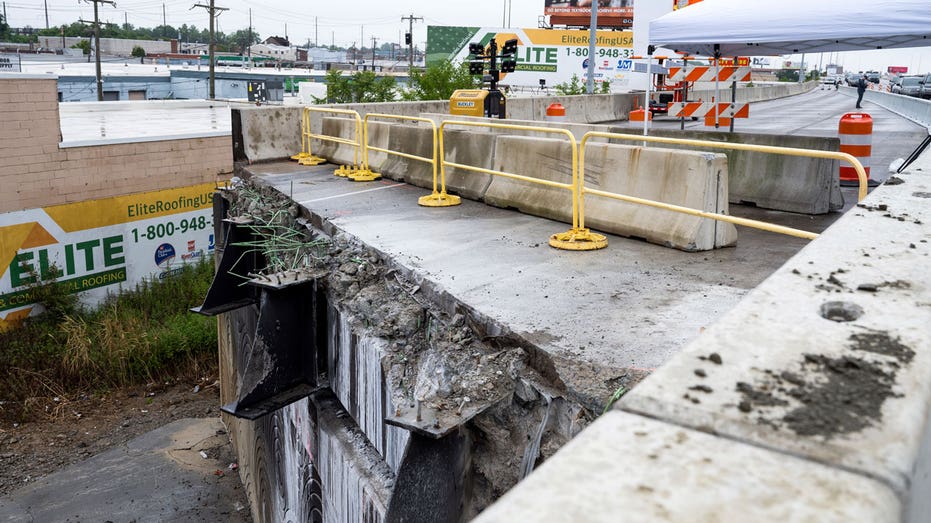 A section of southbound I-95 is removed by workers after its collapse