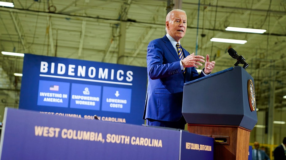 Biden in front of Bidenomics banner on South Carolina stage