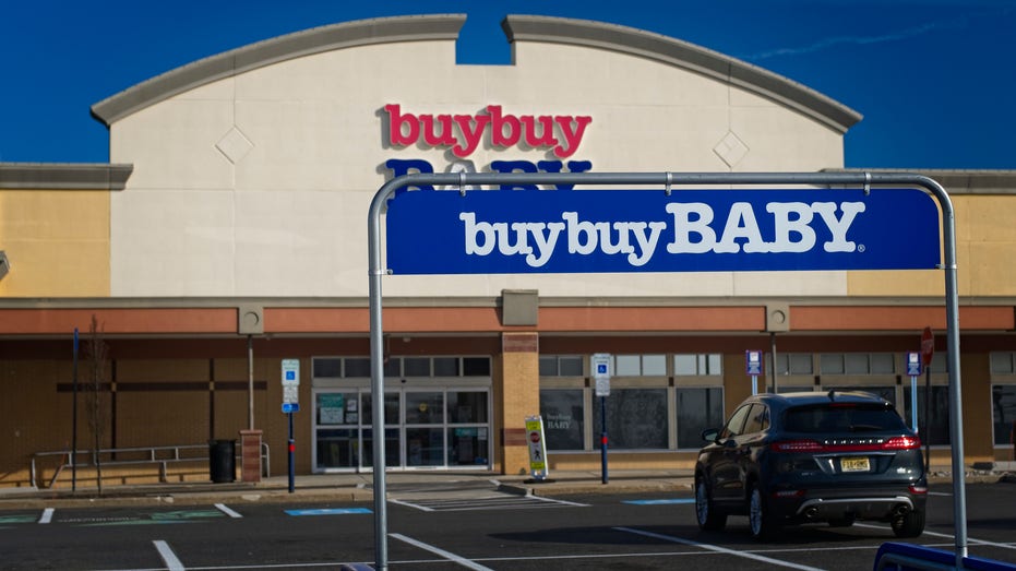 buy buy Baby store with cart return rack in foreground