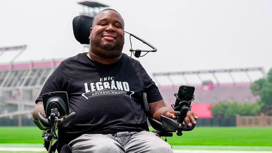 Eric LeGrande smiles on Rutgers football field