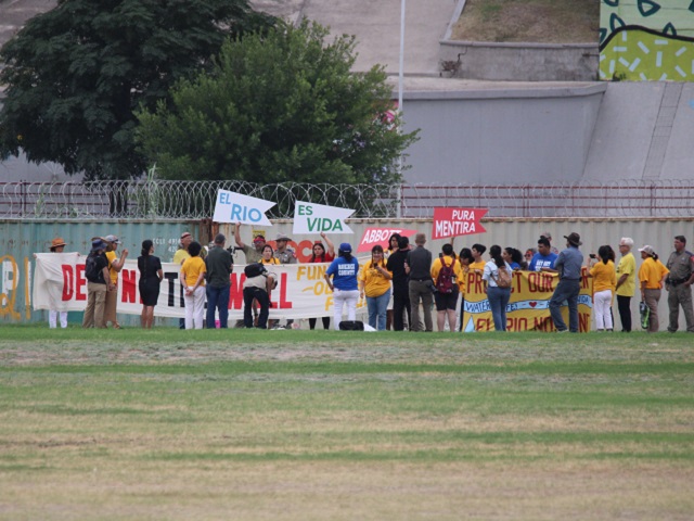 Protesters gather along the Rio Grande in Eagle Pass, Texas, to demonstrate against Abbott's floating border barrier. (Randy Clark/Breitbart Texas)