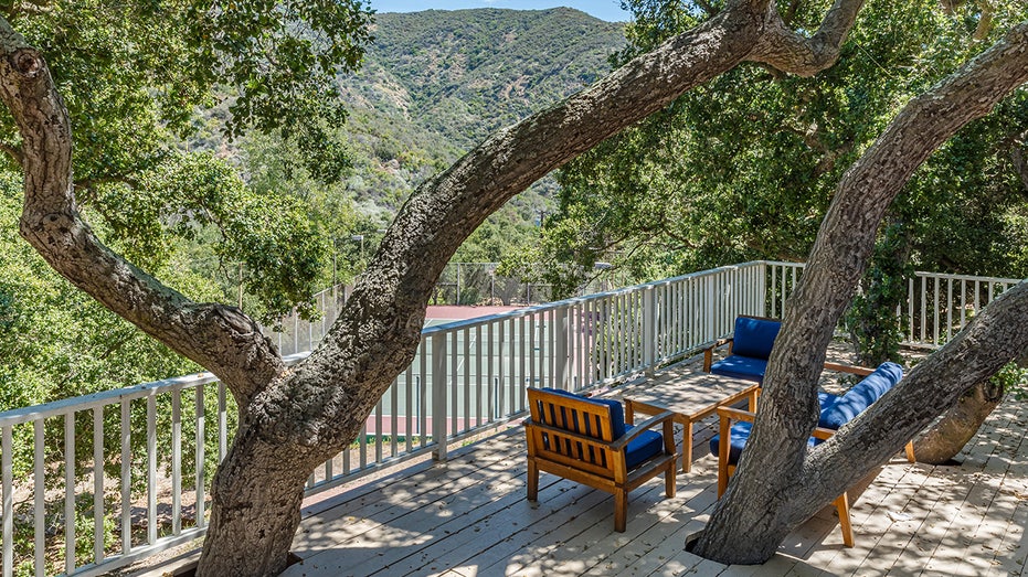 An outdoor seating area overlooking the mountains