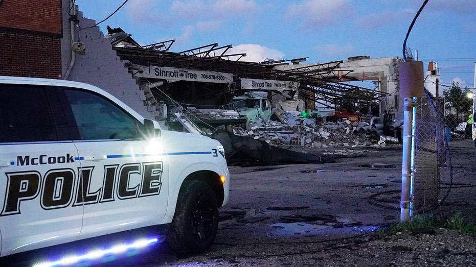 A police vehicle pulls up on the damaged Sinnott Tree Service Building in Chicago, Illinois