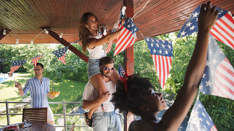 Family hangs up American flag