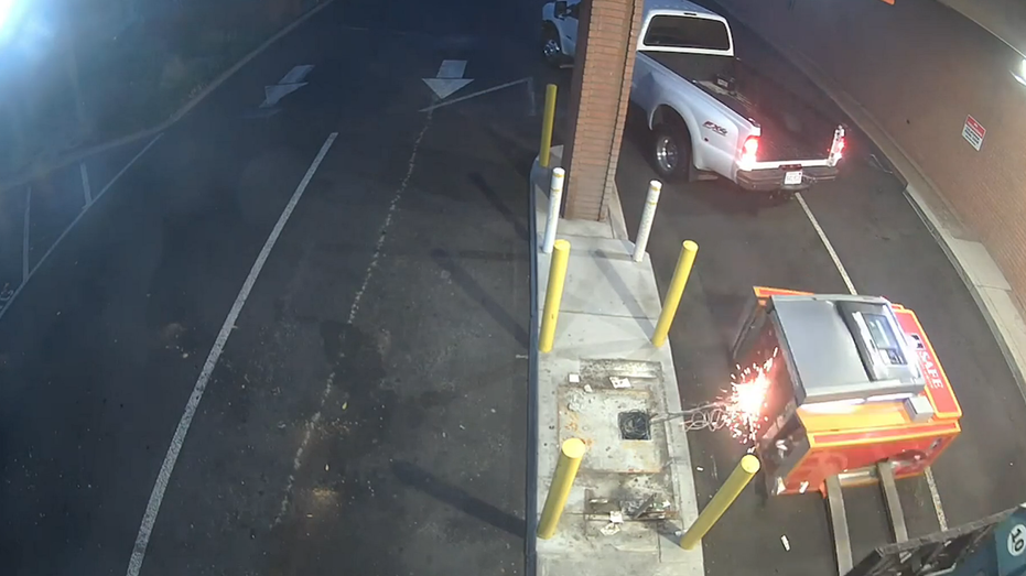 Sparks fly as forklift impales bank ATM