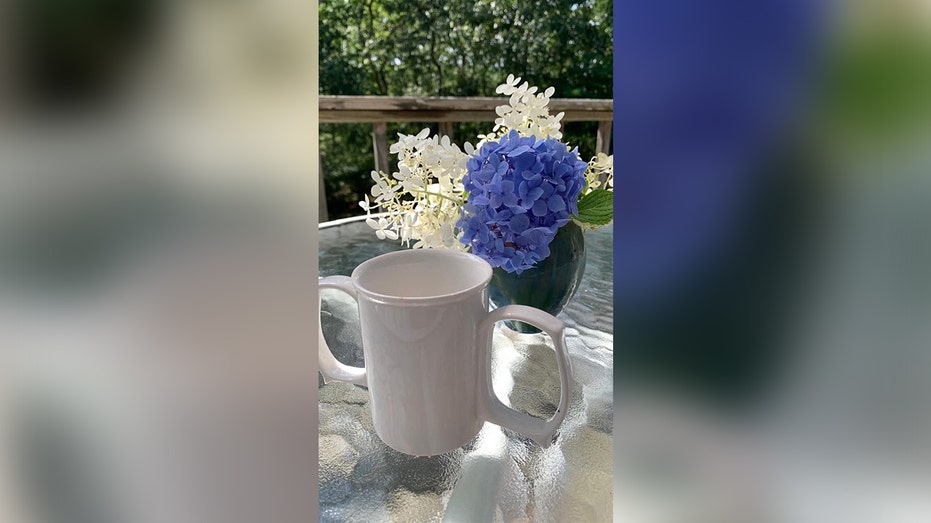 Granny Jo mug with two handles on a table