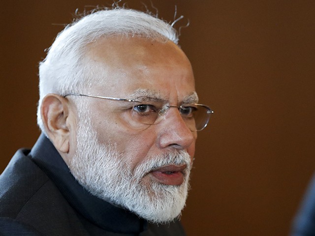 Indian Prime Minister Narendra Modi speaks to Russian President Vladimir Putin during their meeting on the sideline of the 11th edition of the BRICS Summit, in Brasilia, Brazil, Wednesday, Nov. 13, 2019. The BRICS Summit, gathering the leaders of Brazil, Russia, India, China and South Africa, will take place in Brasilia Nov. 13-14. (AP Photo/Pavel Golovkin, Pool)