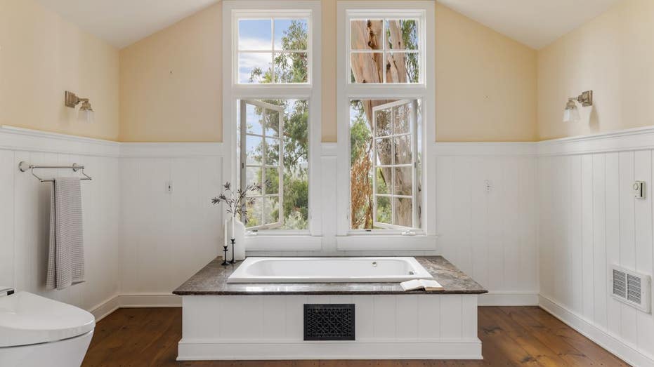 master bathroom with bathtub