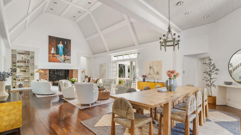 room with high ceilings chairs and a dining table