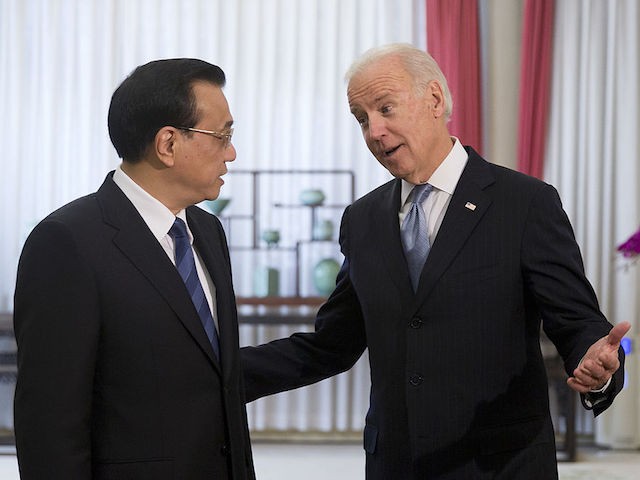 BEIJING, CHINA - DECEMBER 05: U.S. Vice President Joe Biden (R), chats with Chinese Premier Li Keqiang before heading to their meeting at the Zhongnanhai diplomatic compound on December 5, 2013 in Beijing, China. U.S Vice President Joe Biden is on an official visit to China from December 4 to 5. (Photo by Andy Wong-Pool/Getty Images)