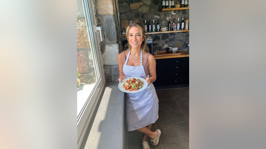 Jessie James Decker holding plate of food