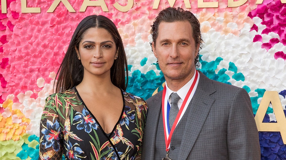 Camila McConaughey and Matthew McConaughey posing together