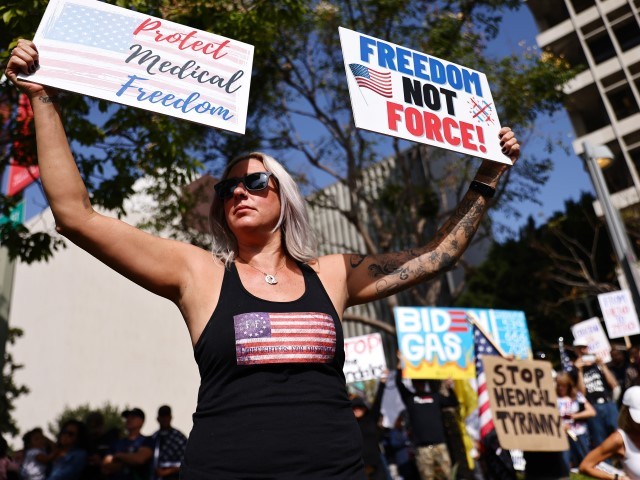 LOS ANGELES, CALIFORNIA - NOVEMBER 08: Protestors gather in Grand Park outside City Hall at a March for Freedom rally demonstrating against the L.A. City Council’s COVID-19 vaccine mandate for city employees and contractors on November 8, 2021, in Los Angeles, California. The City Council has set a deadline of December 18 for all city employees and contractors to be vaccinated except for those who have religious or medical exemptions.