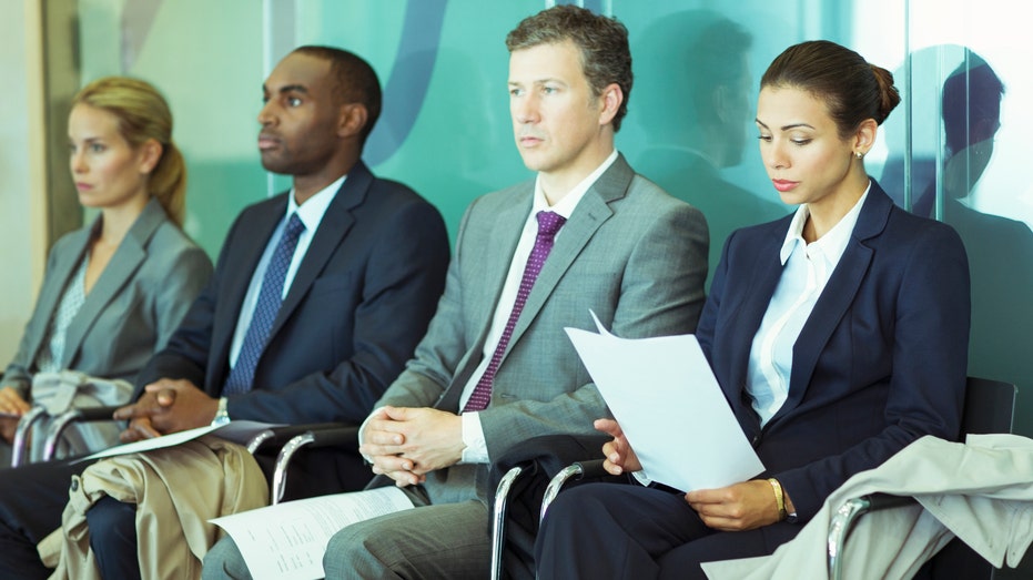 Business people sitting in a row.