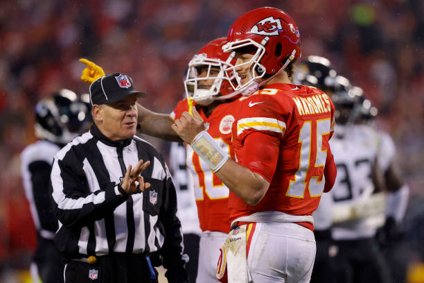 Patrick Mahomes of the Kansas City Chiefs talks with umpire Paul King on challenge of a first down marker against the Jacksonville Jaguars during the...