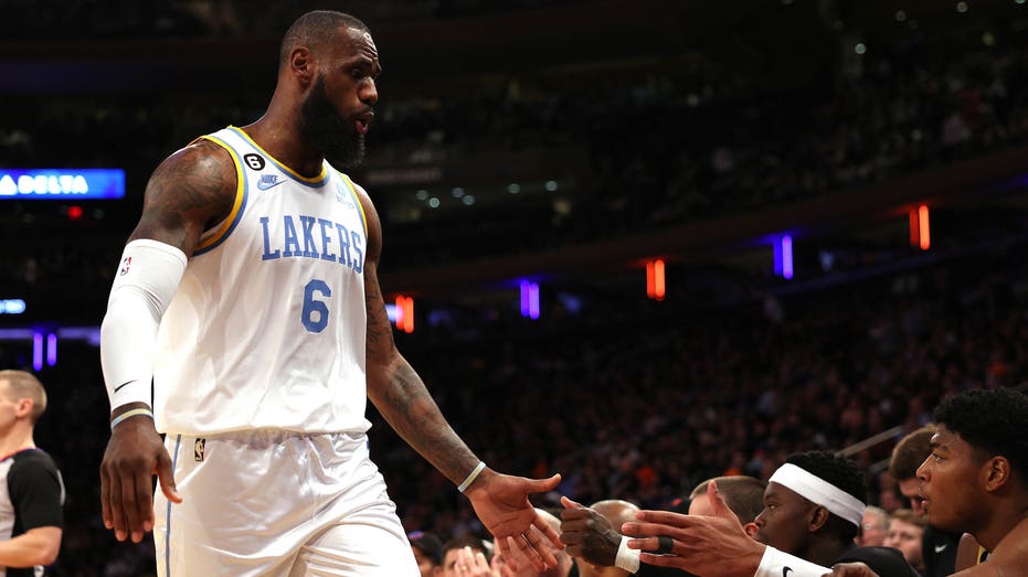 LeBron James high-fives teammates