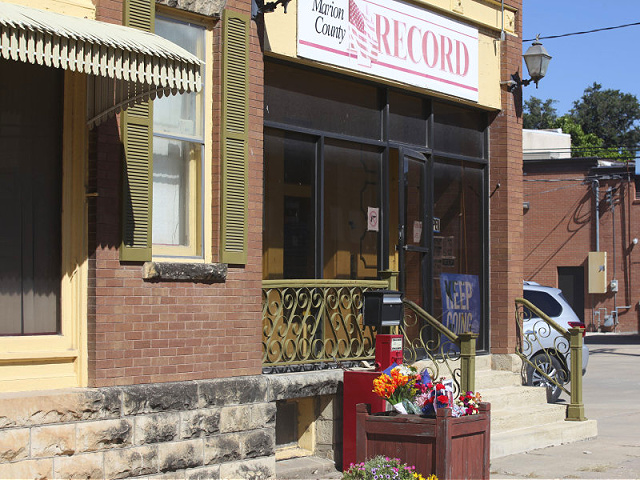 The offices of the Marion County Record await the arrival of copies of its latest weekly edition, Wednesday, Aug. 16, 2023, in Marion, Kan. The paper found its work on that edition hindered because of raid on its offices and the home of its publisher on Aug. 11, 2023, by local police. (AP Photo/John Hanna)