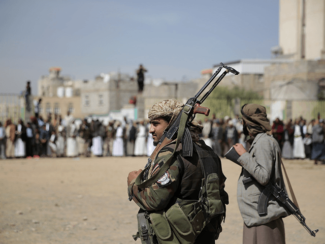 Armed Houthi fighters attend the funeral procession of Houthi rebel fighters who were killed in recent fighting with forces of Yemen's internationally recognized government, in Sanaa, Yemen, on Nov. 24, 2021. A clan-based militia government in the Arab world's poorest country is presenting the Biden administration with its latest foreign policy frustrations. Yemen's Houthis have launched three cross-border strikes with drones and ballistic missiles into the United Arab Emirates in as many weeks. (AP Photo/Hani Mohammed, File)