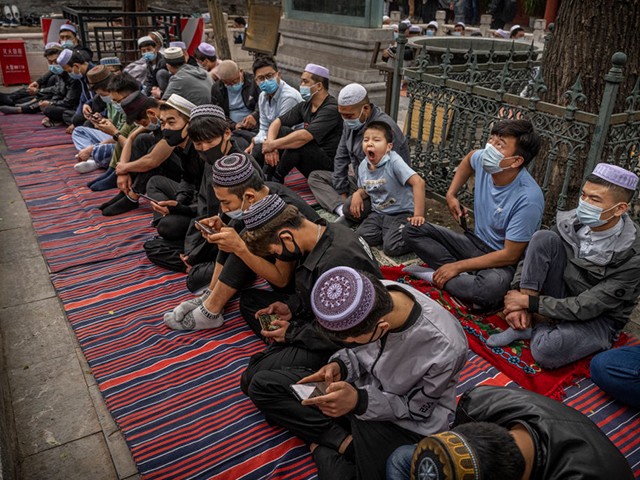 BEIJING, CHINA - MAY 13: Hui Muslim men gather during Eid al-Fitr prayers at the historic Niujie Mosque on May 13, 2021 in Beijing, China. Islam in China dates back to the 10th century as the legacy of Arab traders who ventured from the Middle East along the ancient Silk Road. Of an estimated 23 million Muslims in China, roughly half are Hui, who are ethnically Chinese and speak Mandarin. (Photo by Kevin Frayer/Getty Images)