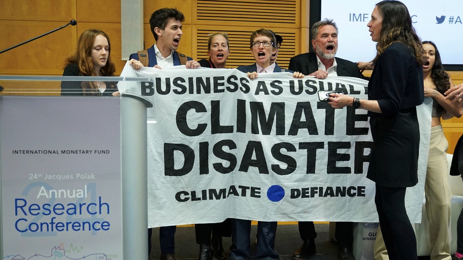 Federal Reserve Jerome Powell climate protesters IMF