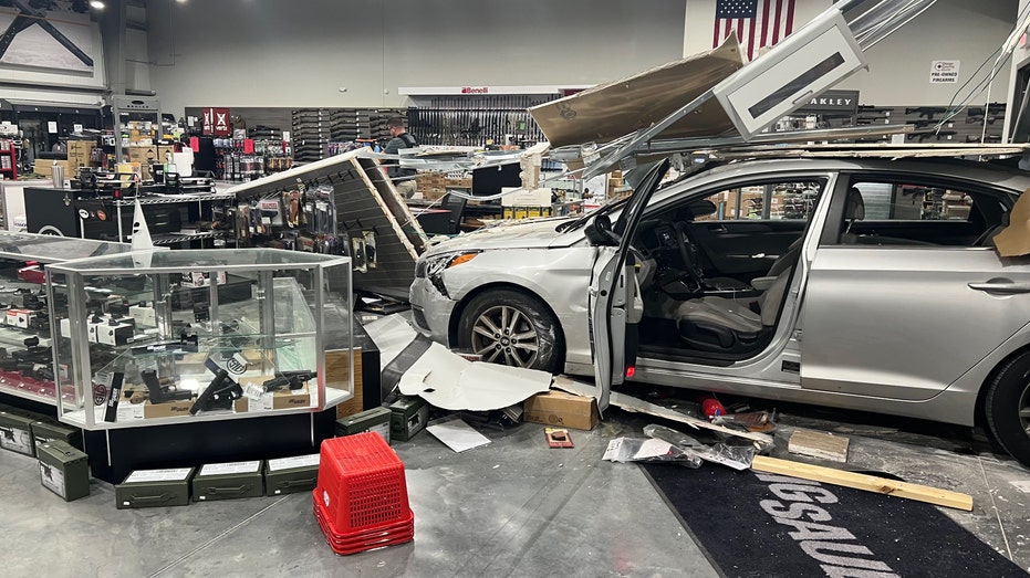 gray sedan inside a gun store