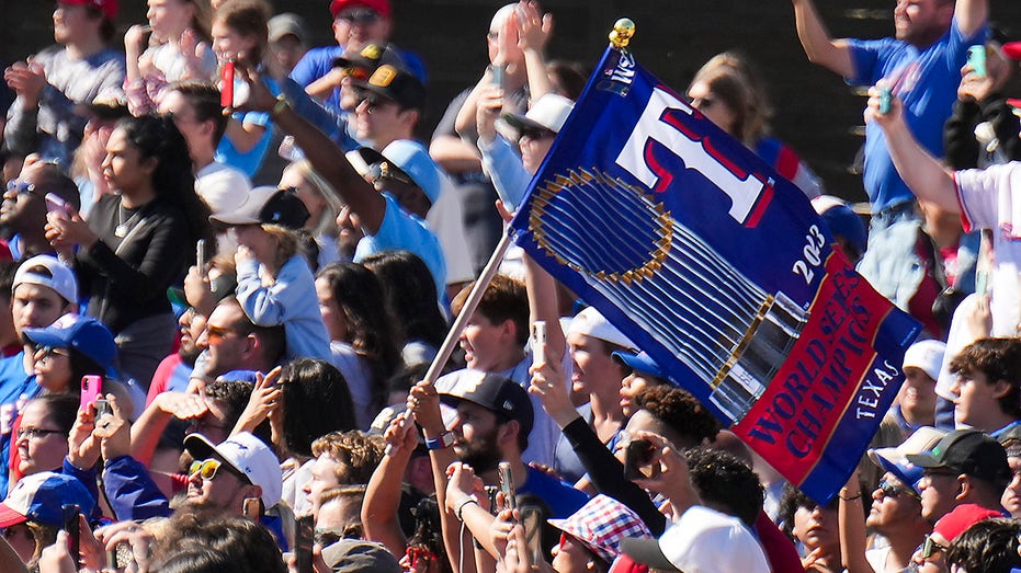 Fans celebrate the Rangers World Series win