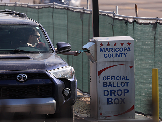 A voter drops his ballot into a drop box at the Maricopa County Tabulation and Election Center on November 07, 2022 in Phoenix, Arizona. With one day to go until election day, early voting continues and mail-in ballots are being tabulated. Arizona voters are casting ballots in very close Midterm elections for both Senator and Governor. (Photo by Justin Sullivan/Getty Images)