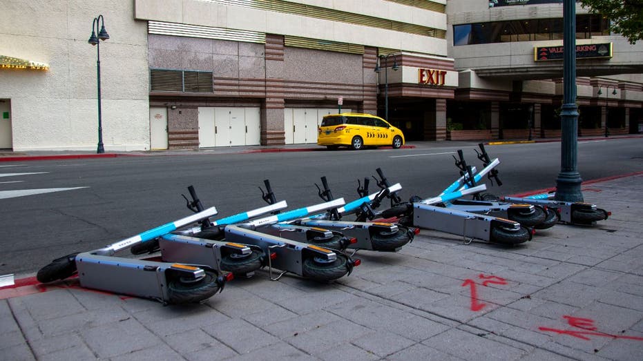 Bird scooters lying on sidewalk