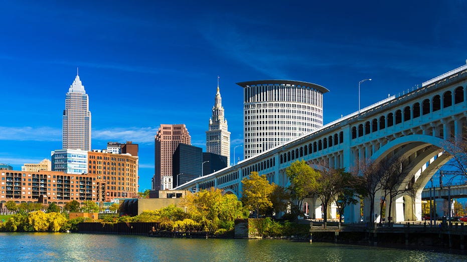 Downtown Cleveland with River, Bridge, Trees, and Deep Blue Sky