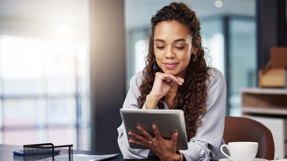 woman working on iPad