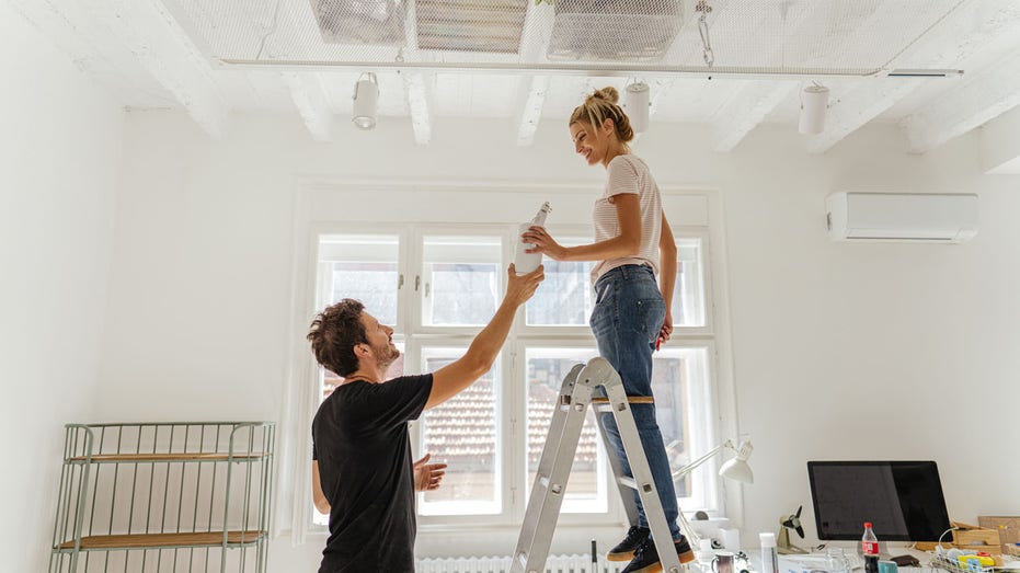 couple painting their home