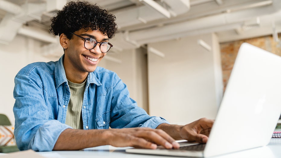 man happily working from home