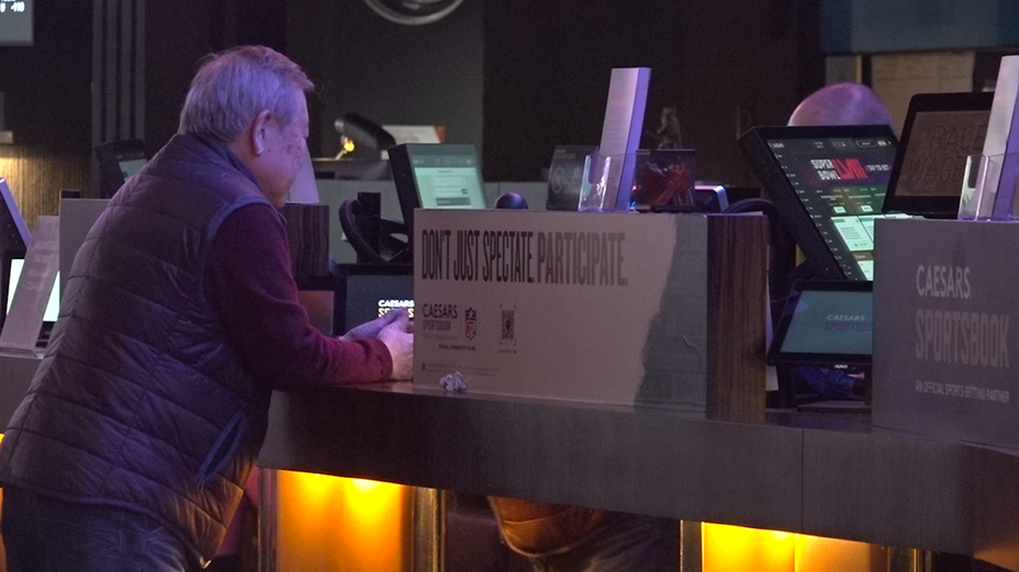 Man at the desk at Caesars Sportsbook