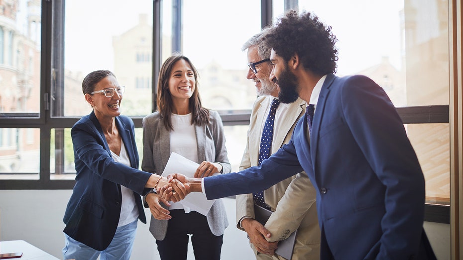 people shaking hands