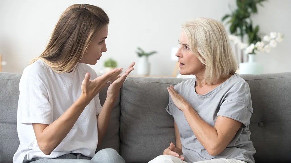 Mother and daughter discussing money