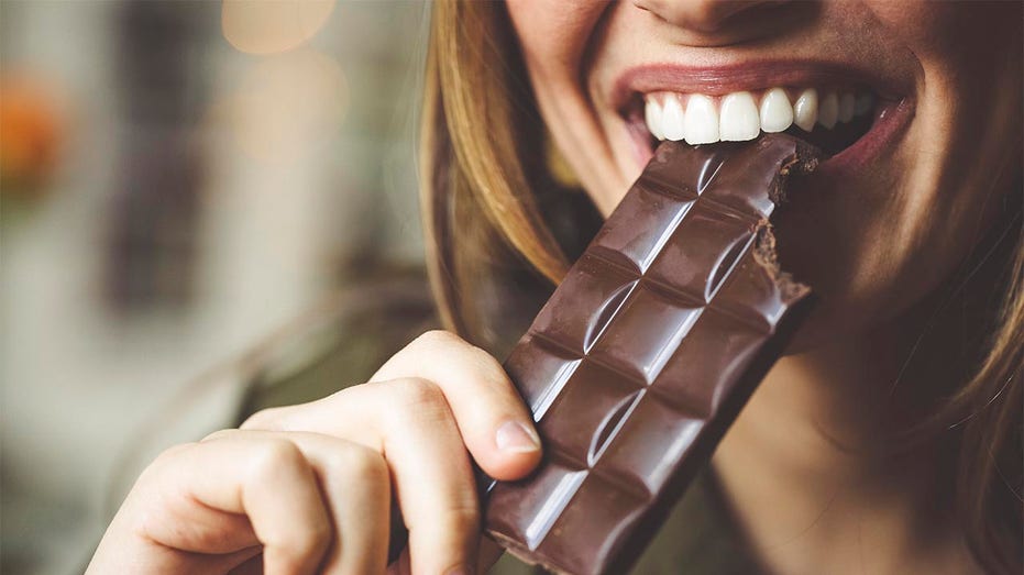 Woman eating chocolate