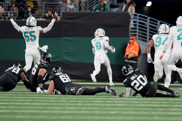 Jevon Holland of the Miami Dolphins scores a 99 yard touchdown off of an interception thrown by Tim Boyle of the New York Jets during the second...