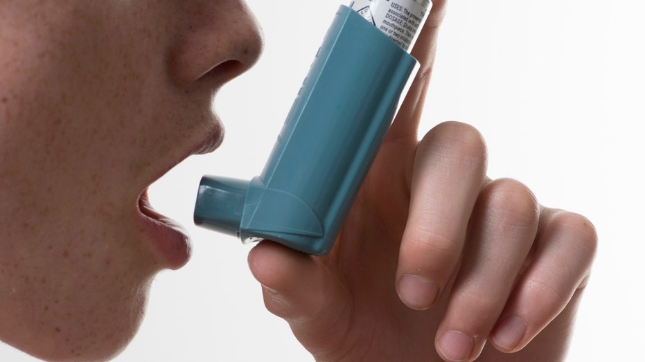 Person using inhaler