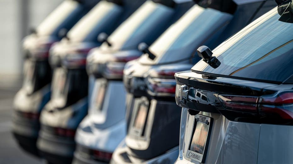 Chevrolet bolts lined up at a dealership