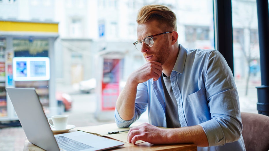 man working at laptop