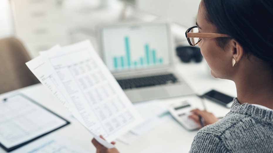 woman reviewing financial documents